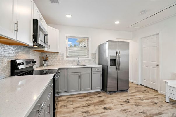 Interior, Kitchen, Recessed Lighting, Stainless Steel Appliances, Wood Texture Flooring