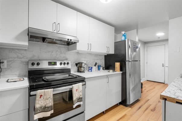 Interior, Kitchen, Marble Walls, Recessed Lighting, Stainless Steel Appliances, Wood Texture Flooring
