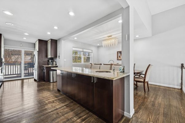 Chandelier, Dining room, Interior, Kitchen, Recessed Lighting, Stainless Steel Appliances, Wood Texture Flooring