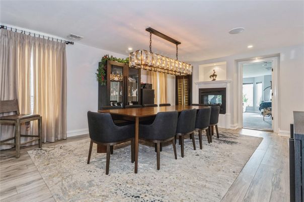 Chandelier, Dining room, Fireplace, Interior, Piano, Recessed Lighting, Wood Texture Flooring