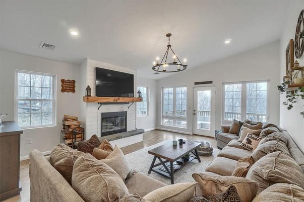 Chandelier, Fireplace, Interior, Living room, Recessed Lighting, Wood Texture Flooring