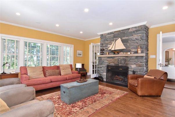 Fireplace, Interior, Living room, Recessed Lighting, Stone Walls, Wood Texture Flooring