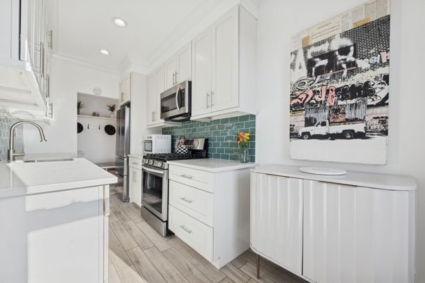 Interior, Kitchen, Recessed Lighting, Stainless Steel Appliances, Washer, Wood Texture Flooring