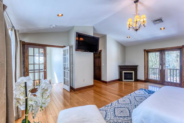 Bedroom, Chandelier, Fireplace, Interior, Recessed Lighting, Wood Texture Flooring