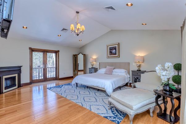 Bedroom, Chandelier, Fireplace, Interior, Recessed Lighting, Wood Texture Flooring
