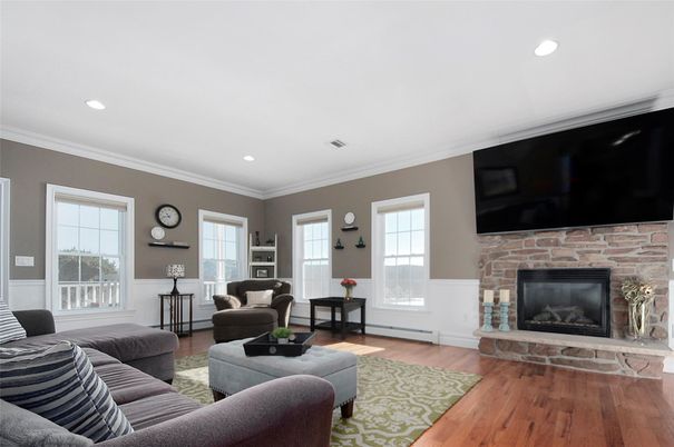 Fireplace, Interior, Living room, Recessed Lighting, Stone Walls, Wood Texture Flooring