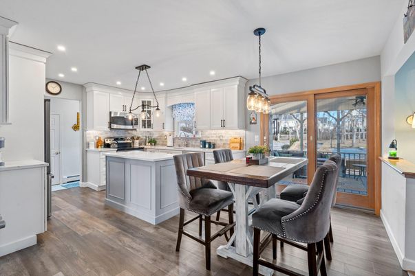 Chandelier, Dining room, Interior, Kitchen, Pendant Lights, Recessed Lighting, Stainless Steel Appliances, Wood Texture Flooring