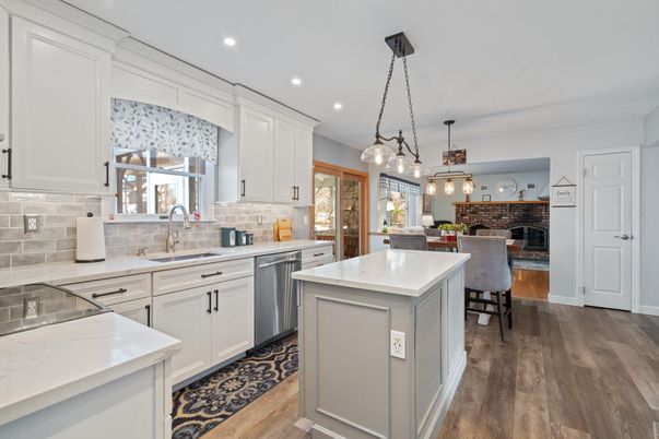 Dining room, Fireplace, Interior, Kitchen, Pendant Lights, Recessed Lighting, Stainless Steel Appliances, Stone Walls, Wood Texture Flooring