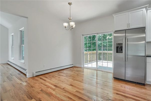 Chandelier, Empty room, Interior, Kitchen, Pendant Lights, Stainless Steel Appliances, Wood Texture Flooring