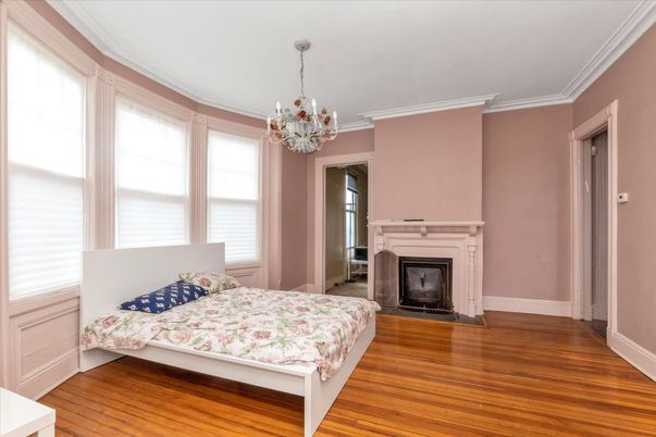 Bedroom, Chandelier, Fireplace, Interior, Wood Texture Flooring