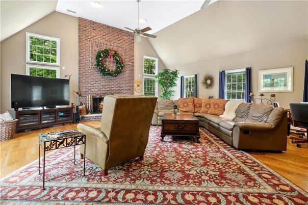 Fireplace, Interior, Living room, Recessed Lighting, Stone Walls, Wood Texture Flooring