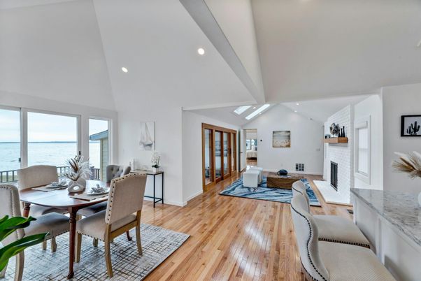 Dining room, Fireplace, Interior, Living room, Recessed Lighting, Water, Wood Texture Flooring
