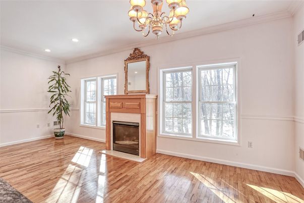 Chandelier, Empty room, Fireplace, Interior, Recessed Lighting, Wood Texture Flooring