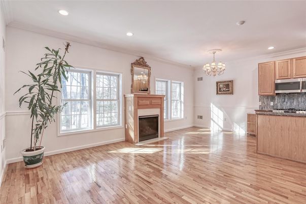 Chandelier, Empty room, Fireplace, Interior, Kitchen, Recessed Lighting, Wood Texture Flooring