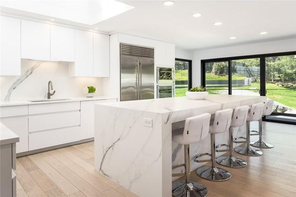 Interior, Kitchen, Marble Walls, Recessed Lighting, Stainless Steel Appliances, Wood Texture Flooring