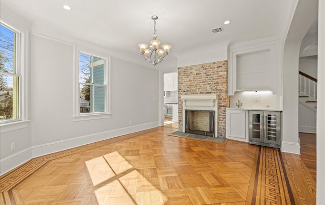 Chandelier, Fireplace, Interior, Recessed Lighting, Stone Walls, Wood Texture Flooring