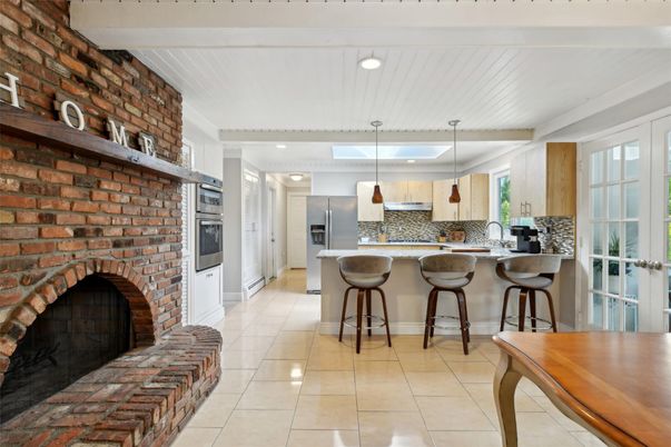Fireplace, Interior, Kitchen, Pendant Lights, Recessed Lighting, Stainless Steel Appliances, Stone Walls