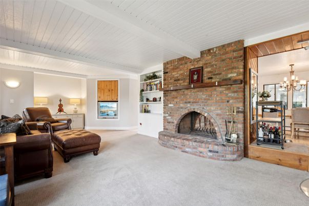 Chandelier, Dining room, Fireplace, Interior, Living room, Stone Walls
