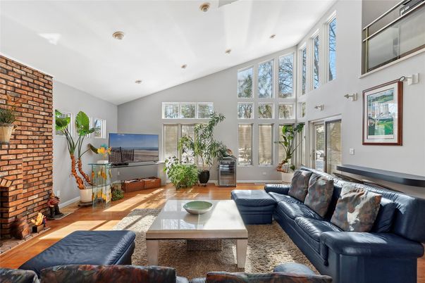 Fireplace, Interior, Living room, Recessed Lighting, Stone Walls, Wood Texture Flooring