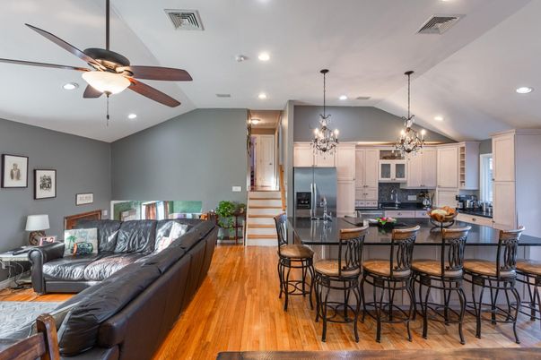 Chandelier, Interior, Kitchen, Living room, Pendant Lights, Recessed Lighting, Stainless Steel Appliances, Wood Texture Flooring