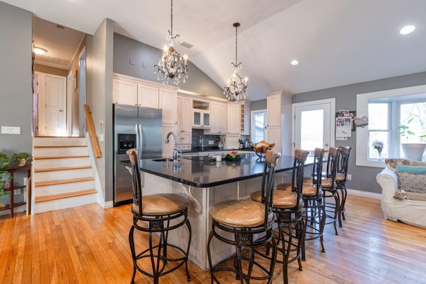 Chandelier, Dining room, Interior, Kitchen, Pendant Lights, Recessed Lighting, Stainless Steel Appliances, Wood Texture Flooring