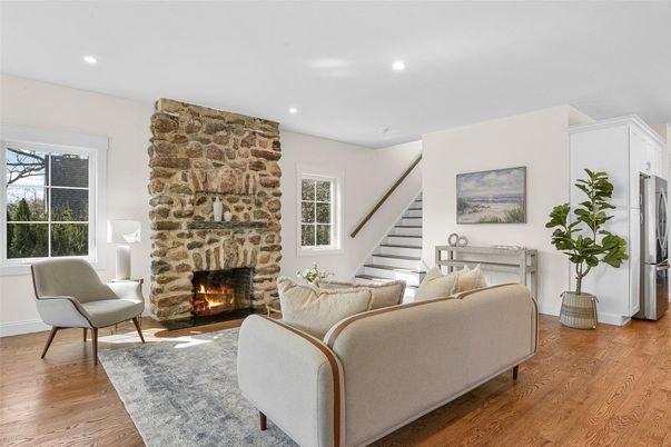 Fireplace, Interior, Living room, Recessed Lighting, Stone Walls, Wood Texture Flooring