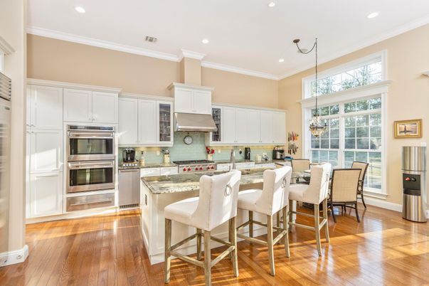 Chandelier, Dining room, Interior, Kitchen, Pendant Lights, Recessed Lighting, Stainless Steel Appliances, Wood Texture Flooring