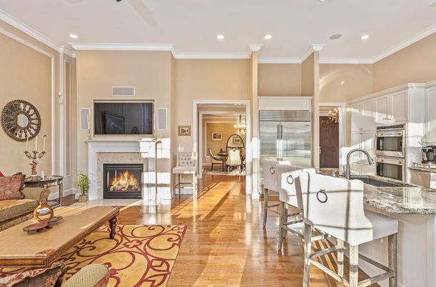 Dining room, Fireplace, Interior, Kitchen, Recessed Lighting, Stainless Steel Appliances, Wood Texture Flooring