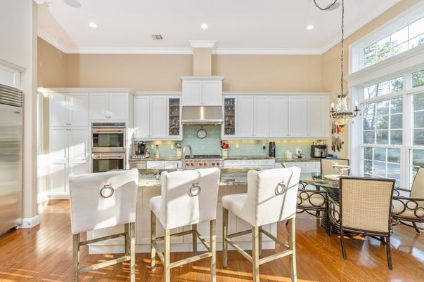 Chandelier, Dining room, Interior, Kitchen, Pendant Lights, Recessed Lighting, Stainless Steel Appliances, Wood Texture Flooring