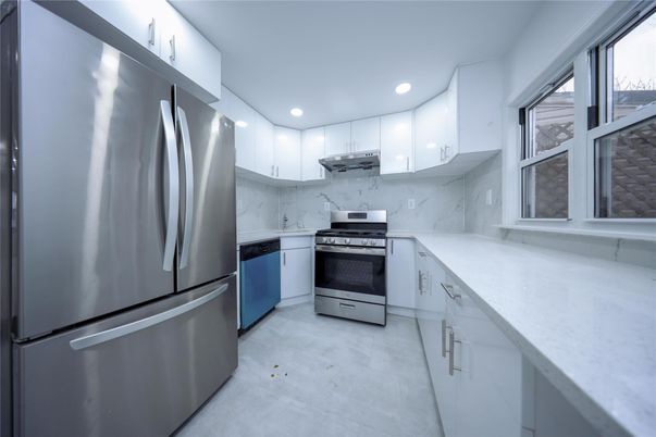 Interior, Kitchen, Marble Walls, Recessed Lighting, Stainless Steel Appliances