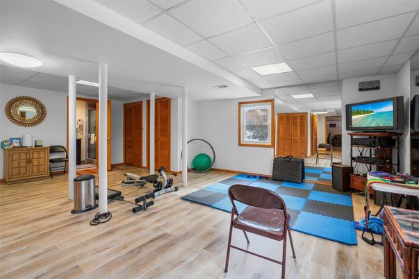 Fireplace, Fitness Equipment, Interior, Recessed Lighting, Wood Texture Flooring