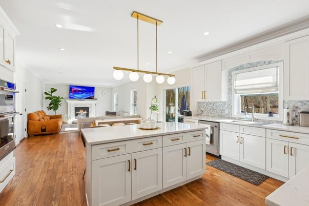Fireplace, Interior, Kitchen, Living room, Pendant Lights, Recessed Lighting, Stainless Steel Appliances, Wood Texture Flooring