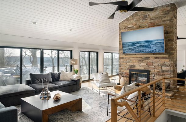 Fireplace, Interior, Living room, Recessed Lighting, Stone Walls, Wood Texture Flooring