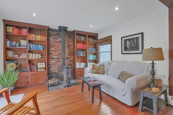 Fireplace, Interior, Living room, Recessed Lighting, Stone Walls, Wood Texture Flooring