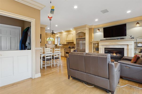 Dining room, Fireplace, Interior, Kitchen, Living room, Pendant Lights, Recessed Lighting, Stainless Steel Appliances, Wood Texture Flooring