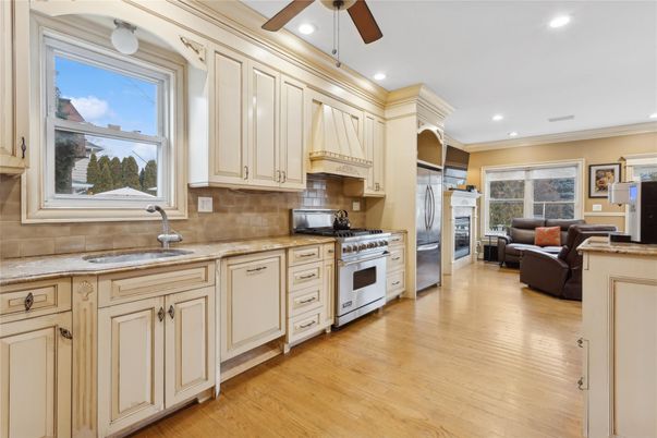 Fireplace, Interior, Kitchen, Living room, Recessed Lighting, Stainless Steel Appliances, Wood Texture Flooring