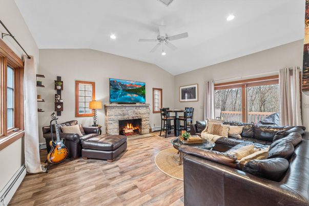 Dining room, Fireplace, Interior, Living room, Recessed Lighting, Wood Texture Flooring