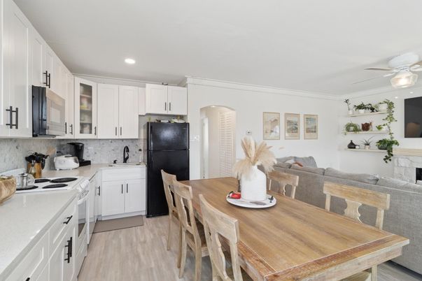 Dining room, Fireplace, Interior, Kitchen, Recessed Lighting, Wood Texture Flooring