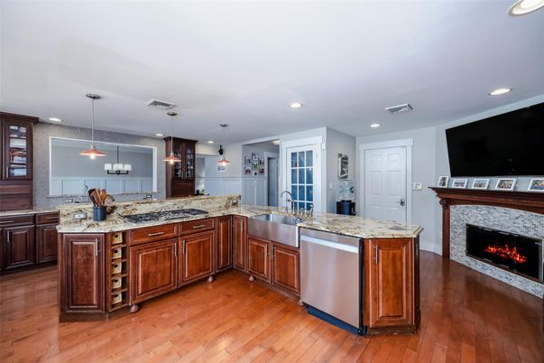 Fireplace, Interior, Kitchen, Pendant Lights, Recessed Lighting, Stainless Steel Appliances, Wood Texture Flooring