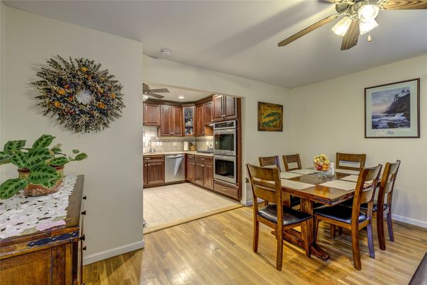 Dining room, Interior, Kitchen, Recessed Lighting, Stainless Steel Appliances, Wood Texture Flooring