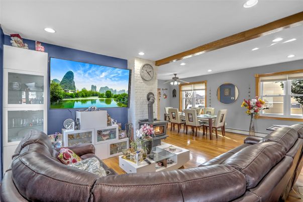 Dining room, Fireplace, Interior, Living room, Recessed Lighting, Stone Walls, Wooden Beams, Wood Texture Flooring
