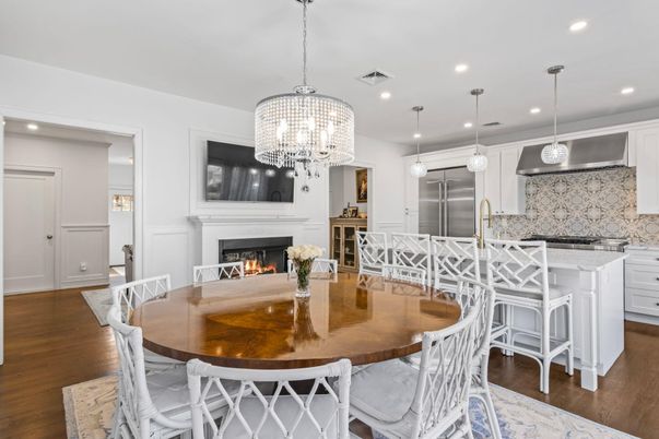 Chandelier, Dining room, Fireplace, Interior, Kitchen, Pendant Lights, Recessed Lighting, Stainless Steel Appliances, Wood Texture Flooring