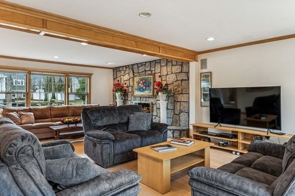 Fireplace, Interior, Living room, Recessed Lighting, Stone Walls, Wood Texture Flooring