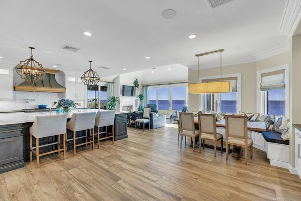 Chandelier, Dining room, Fireplace, Interior, Kitchen, Living room, Pendant Lights, Recessed Lighting, Water, Wood Texture Flooring