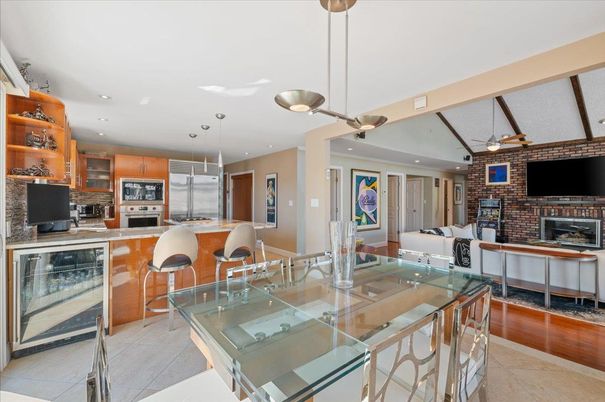 Dining room, Fireplace, Interior, Kitchen, Living room, Pendant Lights, Recessed Lighting, Stainless Steel Appliances, Stone Walls, Wood Texture Flooring