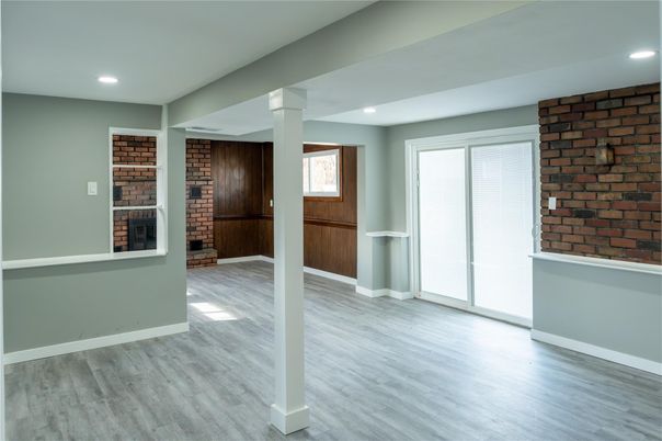 Empty room, Fireplace, Interior, Recessed Lighting, Stone Walls, Wood Texture Flooring
