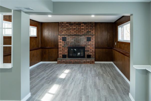 Empty room, Fireplace, Interior, Recessed Lighting, Stone Walls, Wood Texture Flooring, Wooden Walls