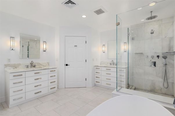 Bathroom, Dual Sink Vanities, Free Standing Baths, Glass Shower, Interior, Marble Walls, Recessed Lighting