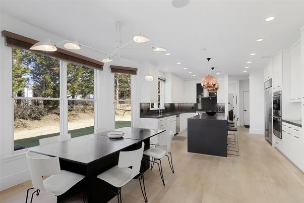 Dining room, Interior, Kitchen, Pendant Lights, Recessed Lighting, Stainless Steel Appliances, Wood Texture Flooring