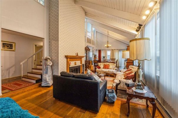 Chandelier, Dining room, Fireplace, Interior, Living room, Stone Walls, Wood Texture Flooring